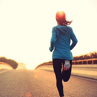 young fitness woman runner athlete running at road