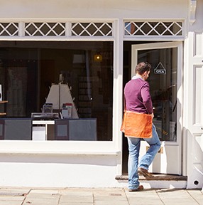 Shop owner opening up record, CD and hi-fi shop