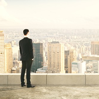 Businessman on the top of builng