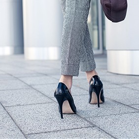 Elegant young businesswoman is going to work