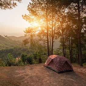Tents on a hills at sunrise at Taksin Maharach