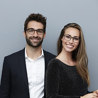 Happy couple smiling at camera, portrait