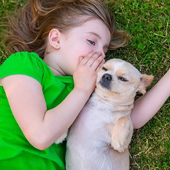 Blond happy girl with her chihuahua doggy portrait