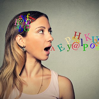 woman talking letters in head coming out of open mouth