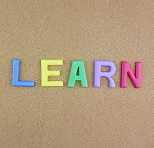 Word "LEARN" next to a pile of other letters