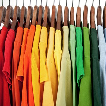 Colors of rainbow, clothes on wooden hangers