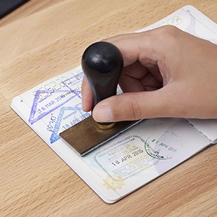 Immigration control officer will arrival stamp in the passport