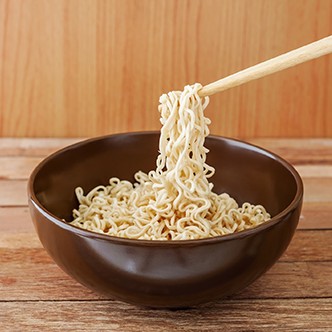 Noodle in brown bowl with wooden chopsticks