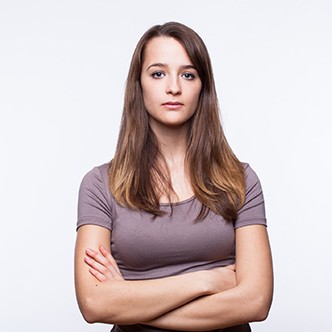 Serious Young Woman With Arms Crossed
